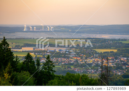 Hradek nad Nisou showcases its charming landscape with the Turow Coal Mine in the background during sunset. 127893989