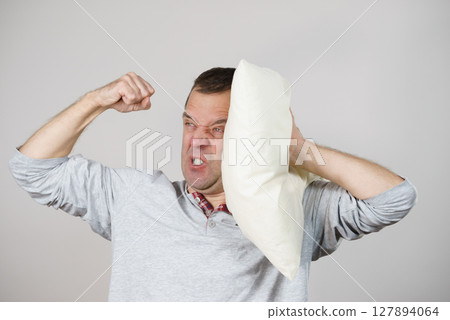 Man can't sleep because of noise Man can't sleep because of noise 127894064