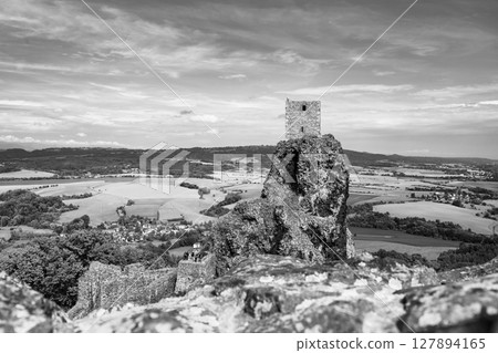 Trosky Castle ruins stand atop a rocky formation, offering a stunning view of the surrounding countryside in Bohemian Paradise, Czechia. 127894165