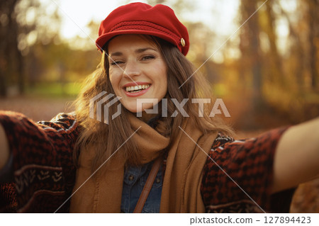 Portrait of smiling elegant woman having web cam meeting Portrait of smiling elegant woman having web cam meeting 127894423