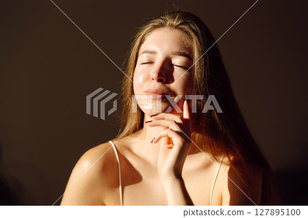 Portrait of beautiful woman without makeup with imperfect skin. Acne skin. Pores on skin of face. Portrait of beautiful woman without makeup with imperfect skin. Acne skin. Pores on skin of face. 127895100