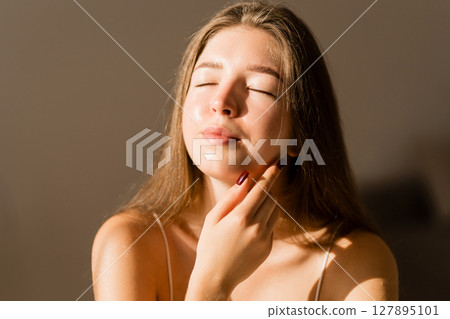 Portrait of beautiful woman without makeup with imperfect skin. Acne skin. Pores on skin of face. Portrait of beautiful woman without makeup with imperfect skin. Acne skin. Pores on skin of face. 127895101