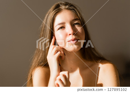 Portrait of beautiful woman without makeup with imperfect skin. Acne skin. Pores on skin of face. Portrait of beautiful woman without makeup with imperfect skin. Acne skin. Pores on skin of face. 127895102