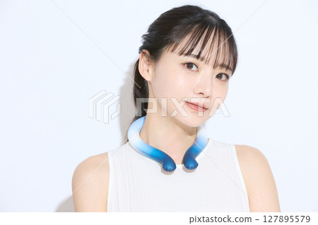 Portrait of a young woman taking measures against the heat Portrait of a young woman taking measures against the heat 127895579