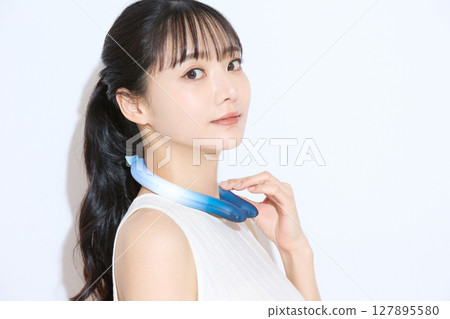 Portrait of a young woman taking measures against the heat Portrait of a young woman taking measures against the heat 127895580