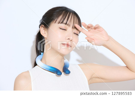 Portrait of a young woman taking measures against the heat Portrait of a young woman taking measures against the heat 127895583