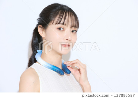 Portrait of a young woman taking measures against the heat Portrait of a young woman taking measures against the heat 127895587