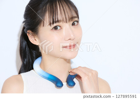 Portrait of a young woman taking measures against the heat Portrait of a young woman taking measures against the heat 127895591