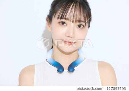 Portrait of a young woman taking measures against the heat Portrait of a young woman taking measures against the heat 127895593