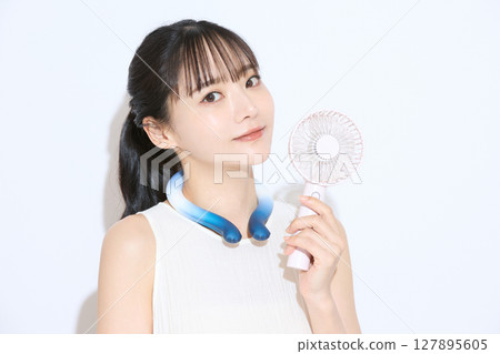 Portrait of a young woman taking measures against the heat 127895605
