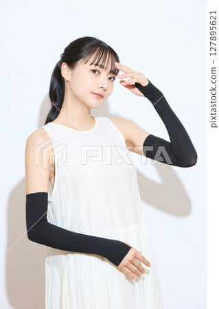 Portrait of a young woman taking measures against the heat Portrait of a young woman taking measures against the heat 127895621