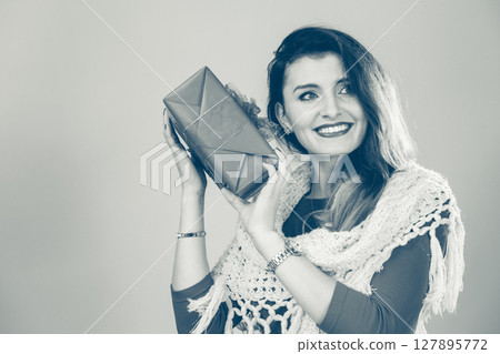 Woman with red christmas gift box Woman with red christmas gift box 127895772