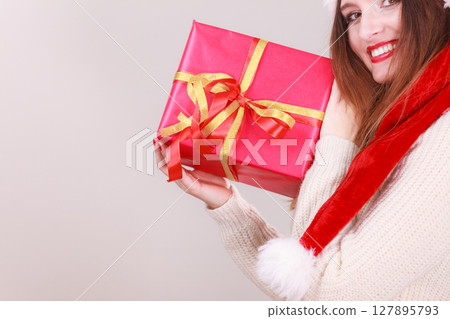 Happy girl holding gift. Happy girl holding gift. 127895793
