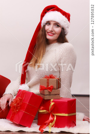 Happy woman make christmas presents 127895832