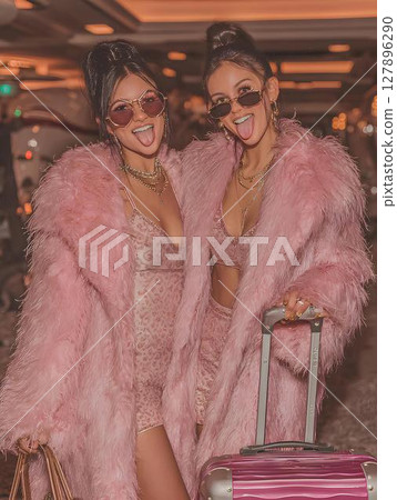 two rich young women at the airport 127896290