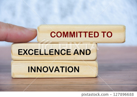 A guiding finger presses forward the idea of commitment to excellence and innovation, symbolizing action, drive, and constant forward motion 127896688