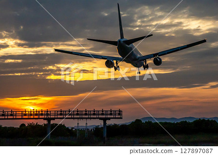 Airplane at dusk Airplane at dusk 127897087