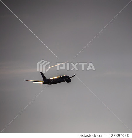 Airplane at dusk Airplane at dusk 127897088