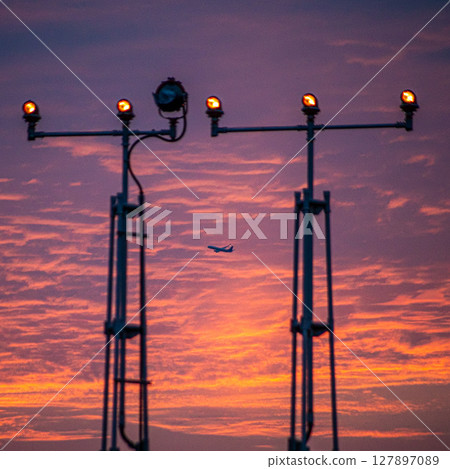 Airplane at dusk Airplane at dusk 127897089
