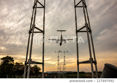 Airplane at dusk 127897092