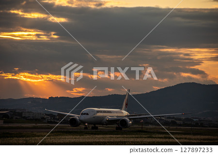Airplane at dusk Airplane at dusk 127897233