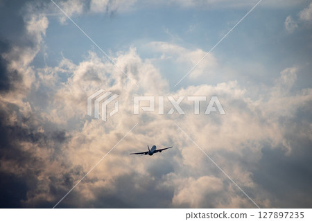 Airplane at dusk Airplane at dusk 127897235