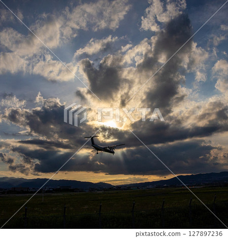 Airplane at dusk 127897236