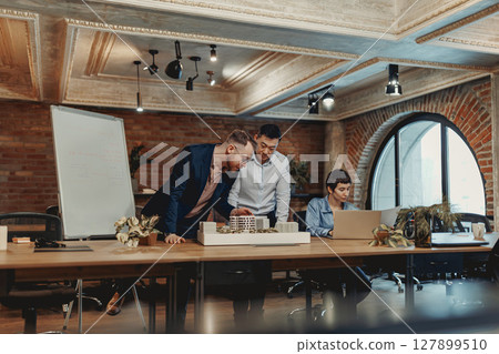 Collaborative Teamwork in a Modern Office Environment Promotes Effective Interaction and Success 127899510