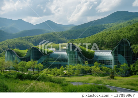 Modern building with a green roof is perfectly integrated into the natural landscape of the south korean mountains 127899967