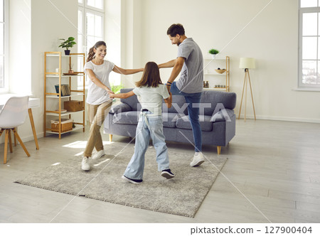 Family Dancing and Playful Fun in the Living Room 127900404