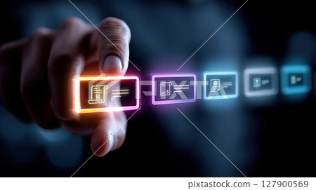 Hand interacts with futuristic digital interface, selecting glowing business document icons in dark environment 127900569