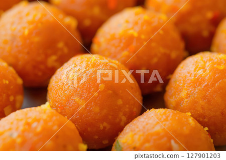 Close up of motichoor ladoo balls forming a textured background of indian sweets 127901203