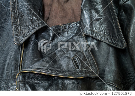 Old and aged black leather perfectoin Old and aged black leather perfectoin 127901873