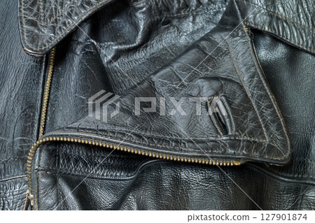Old and aged black leather perfectoin 127901874
