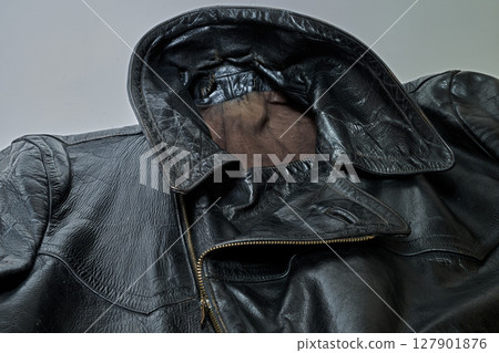 Old and aged black leather perfectoin Old and aged black leather perfectoin 127901876