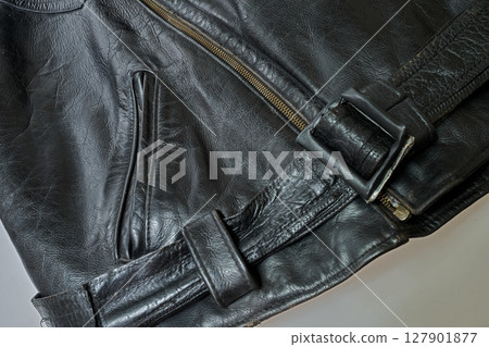 Old and aged black leather perfectoin 127901877