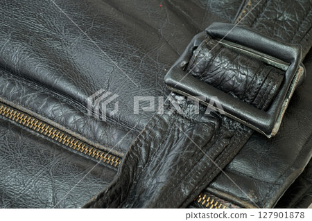 Old and aged black leather perfectoin 127901878