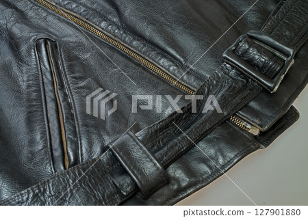 Old and aged black leather perfectoin Old and aged black leather perfectoin 127901880