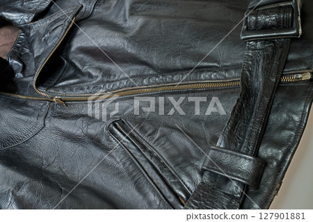Old and aged black leather perfectoin 127901881