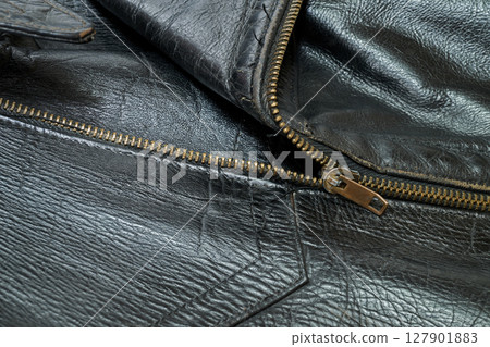 Old and aged black leather perfectoin 127901883