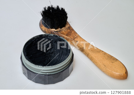 black shoe polish and brush 127901888