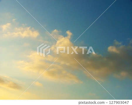 A breathtaking display of beautiful clouds drifting over the skies of Calabria, Italy. Soft, fluffy clouds illuminated by warm sunlight create a serene and captivating atmosphere, enhancing the natura A breathtaking display of beautiful clouds drifting over the skies of Calabria, Italy. Soft, fluffy clouds illuminated by warm sunlight create a serene and captivating atmosphere, enhancing the natura 127903047