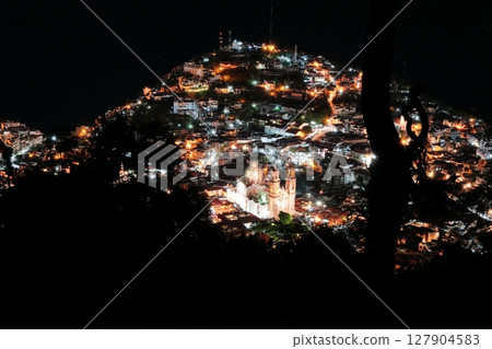 Night view of the city of Taxco, a tourist destination in Central America, Mexico Night view of the city of Taxco, a tourist destination in Central America, Mexico 127904583