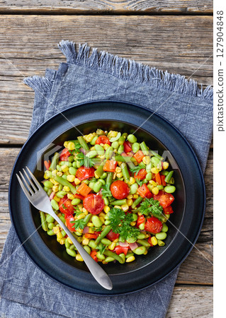 succotash of corn, beans, tomatoes, in black bowl succotash of corn, beans, tomatoes, in black bowl 127904848