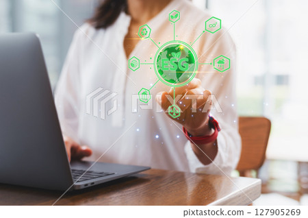Woman entrepreneur focuses on green sustainable business goals. ESG concept icon represents environment social governance strategy for small business progress towards sustainable future Woman entrepreneur focuses on green sustainable business goals. ESG concept icon represents environment social governance strategy for small business progress towards sustainable future 127905269