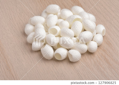 Pile of natural silk cocoons 127906825