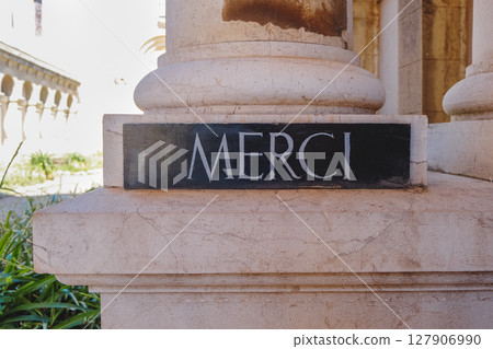 sign with the word merci at Lerins Abbey, France 127906990