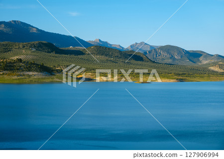 Iznajar reservoir and olive groves in southern Spain Iznajar reservoir and olive groves in southern Spain 127906994