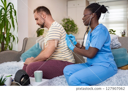 Medical check-up at home with caring professional Medical check-up at home with caring professional 127907062