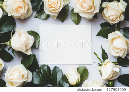 Paper card and frame from white roses . Top view. Paper card and frame from white roses . Top view. 127908009